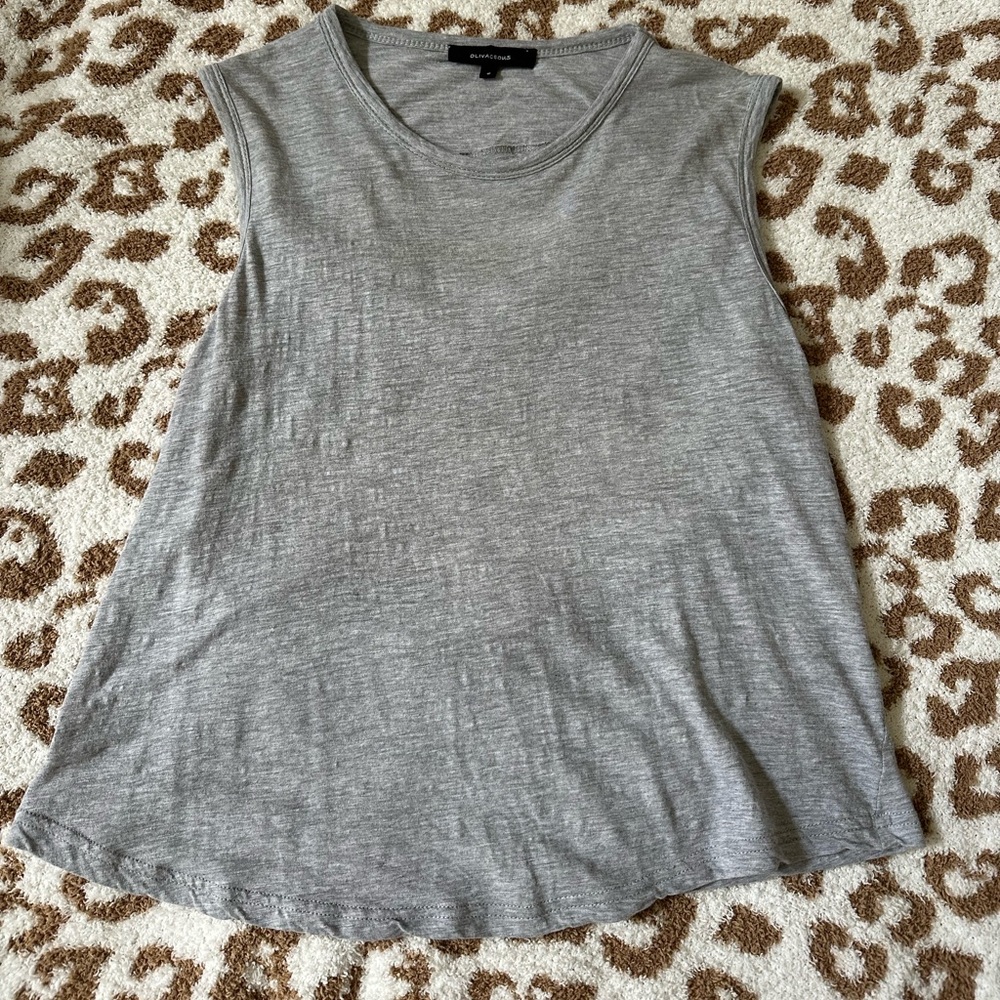 Gray shirt with open slits in the back. Size small.